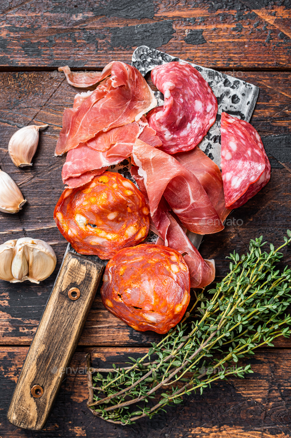 Spanish cured meat salami, jamon, choriso cured sausages on a meat