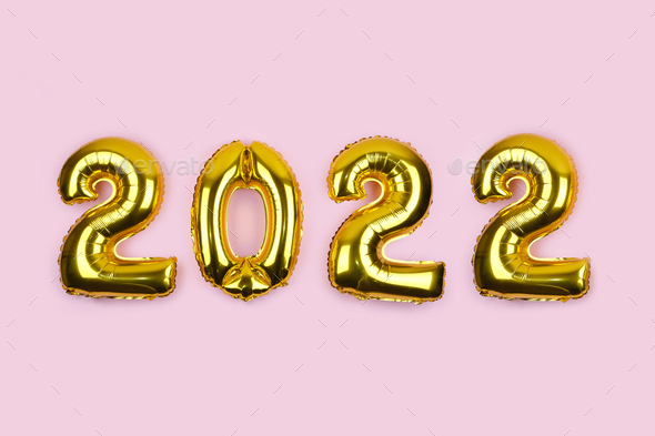 2022 banner with golden foil balloons on pink background. Stock Photo by  IrynaKhabliuk