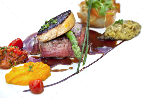 Beef steak and foie gras with vegetable and sauce - Stock Photo - Images