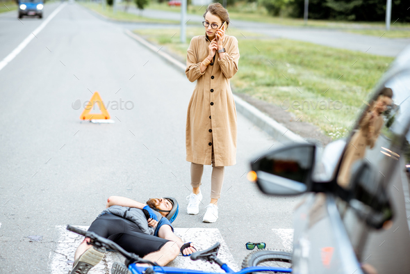 Road accident with injured cyclist and woman driver