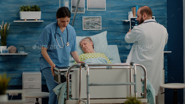 Doctor and nurse rushing to help sick patient with resuscitation Stock ...