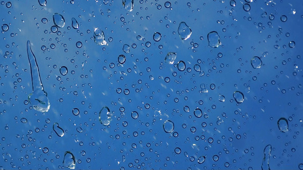 Water Drops With Blue Sky Background