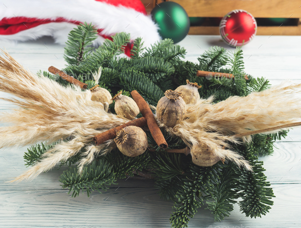 Christmas natural spruce wreath with dry decor, pampas reed