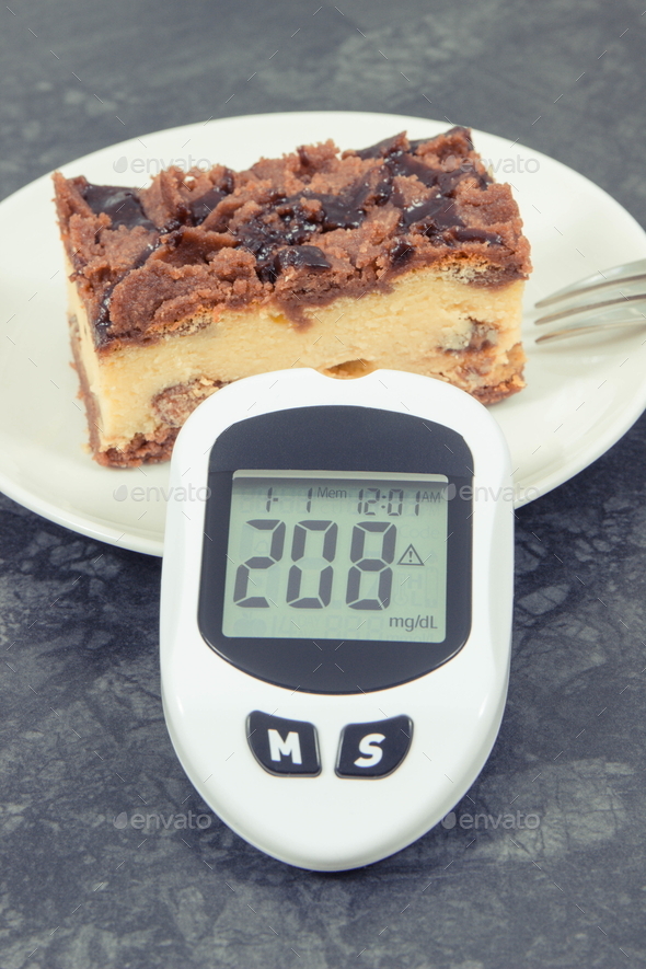 Glucose meter with high and bad result sugar level and fresh baked cheesecake