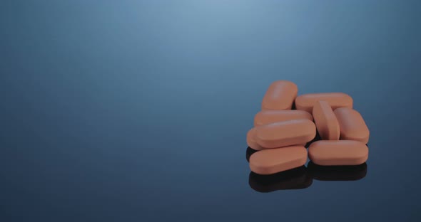 Prescription drugs - Capsules, pills, tablets on reflective background alt