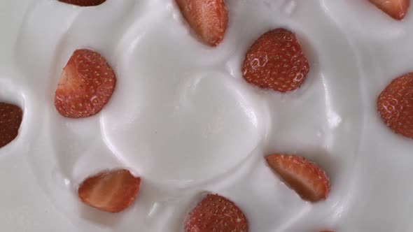 Yogurt decorated with fresh strawberries - Swirl shot