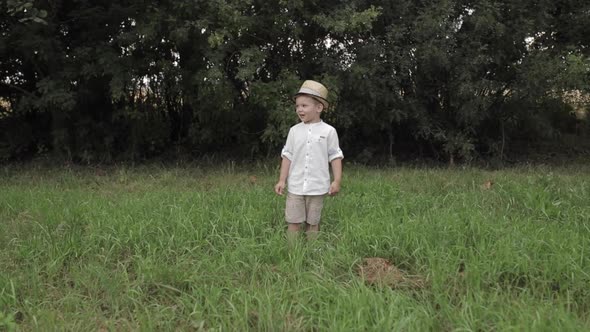 Happy Young Boy Runs To the Camera and Rejoices