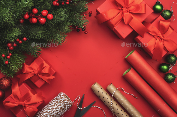 Christmas and Happy New Year red background with boxes, ribbons, bows,  wrapping paper Stock Photo by Olga_Kochina