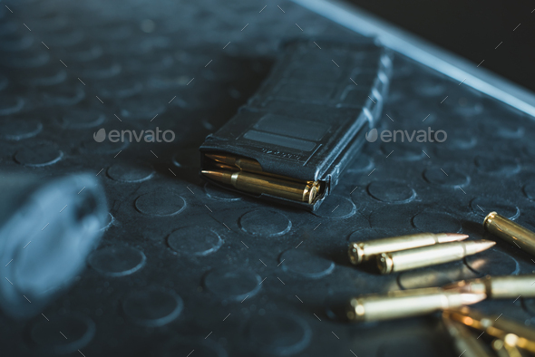 close up view of bullets and rifle magazine on table