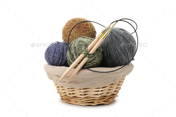 Balls of yarn with knitting needles in basket isolated on white background  Stock Photo by AtlasComposer