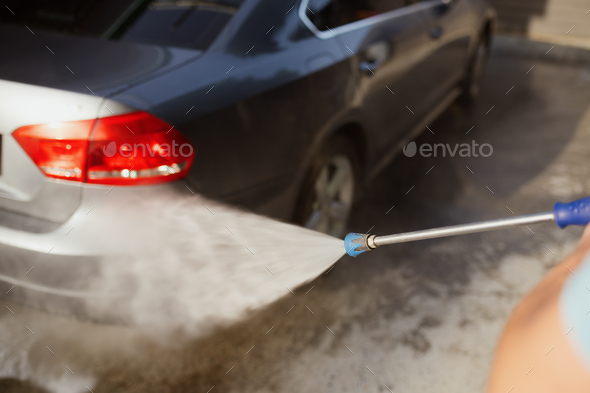 Man Washing Car with Water Gun Stock Image - Image of