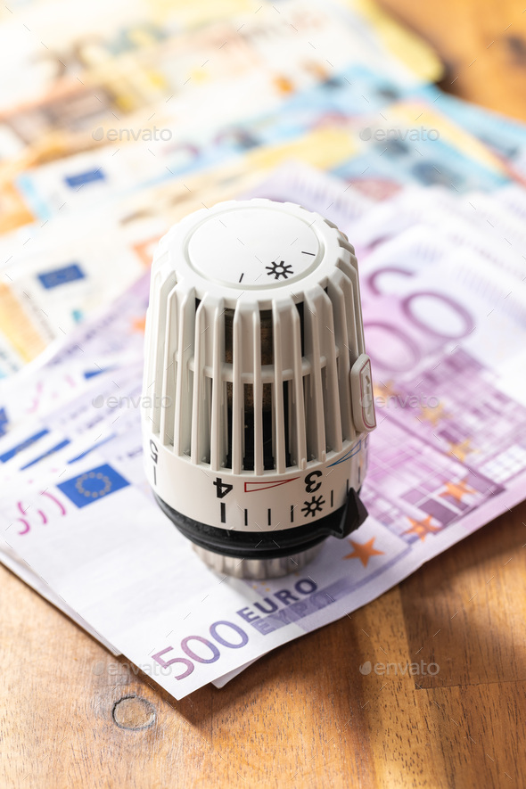 Thermostatic head and Euro money. Euro banknotes. - Stock Photo - Images