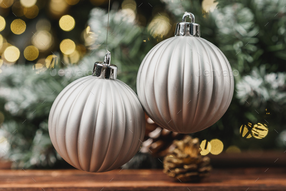 Christmas decorative balls against blurred pine tree background Stock