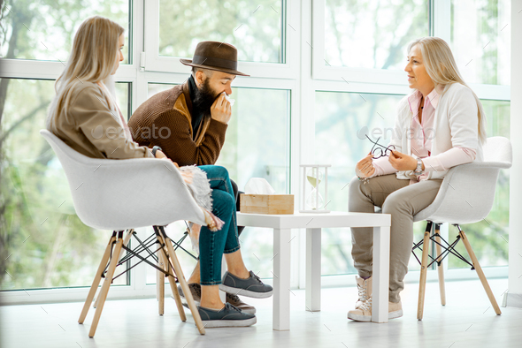 Couple with psychologist in the office