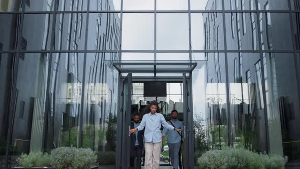 Upset Manager Standing at Office Door alt