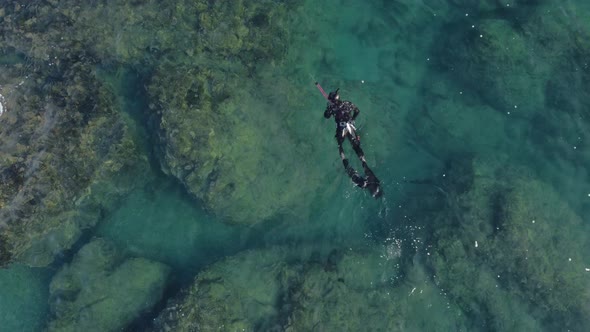 Bird Eye View Shoot of Snorkeling Human in Swimsuit Above Coral Reef alt