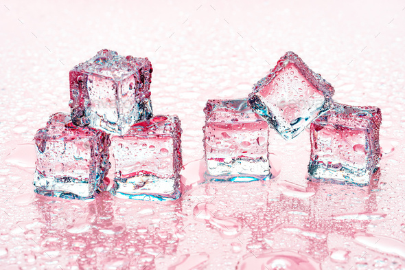 Square melting ice cubes on wet table Stock Photo by FabrikaPhoto