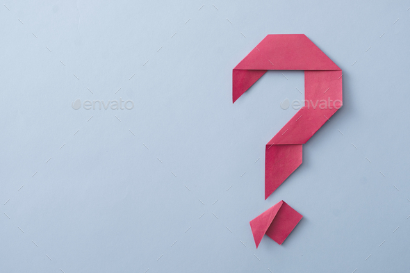 Creative decorative red folded paper origami question mark