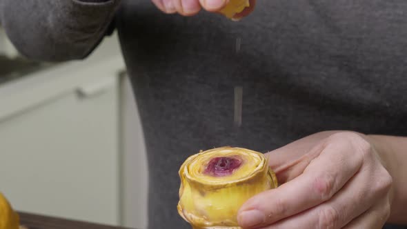 Woman Cleaning Artichokes alt