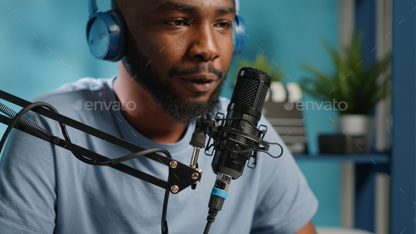 Close up of vlogger using microphone for conversation Stock Photo by DC ...