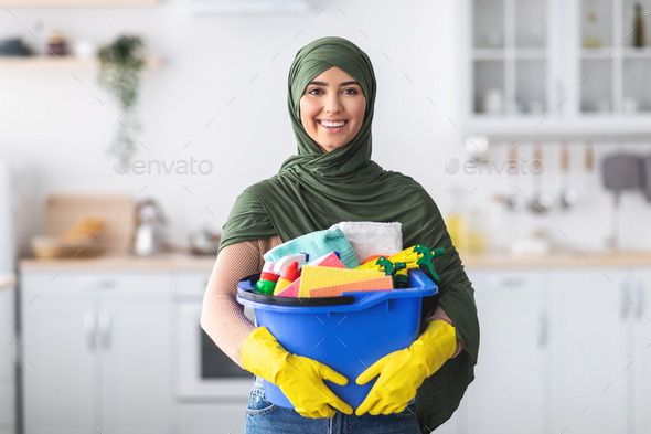 Cheerful Young Housewife Holding Bucket With Cleaning Supplies Stock Photo  - Download Image Now - iStock