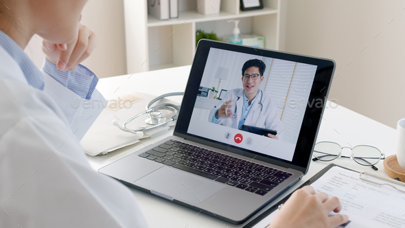 nurse man woman staff in labcoat work online remotely talk on phone at office desk in clinic - Stock Photo - Images