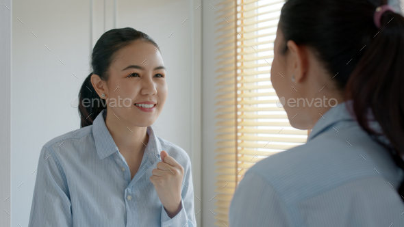 Young adult female asia people self love cheer up pep talk before job interview