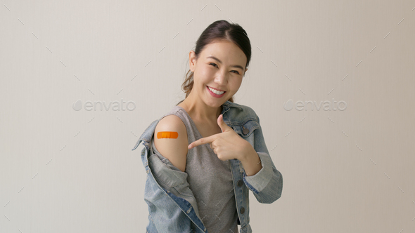 Young attractive beautiful asia female or teenage receive covid-19 anti virus vaccine in campaign