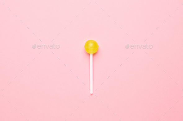 Sweet Yellow Candy Lolipop On Pastel Pink Backgroundminimalist