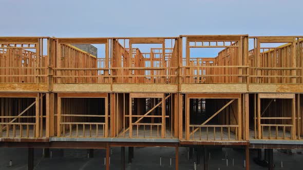 Wood Home Framing at Construction Site with a Wooden Truss Framework alt