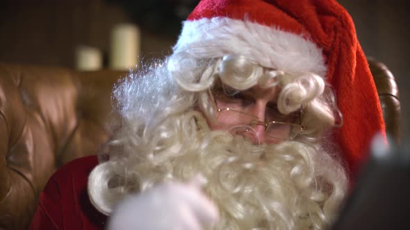 Modern Santa Claus Using Digital Pad alt