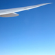 Airplane wing against the blue sky. - PhotoDune Item for Sale