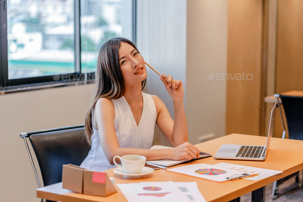 Asian businesswoman in casual suit are thinking and find idea for inspiration in modern office,