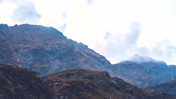Clouds over mountain 4K timelapse alt