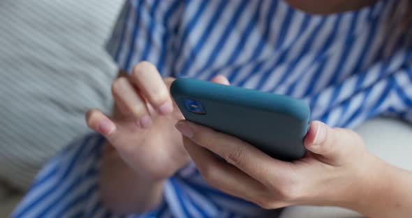 Woman use smart phone at home alt