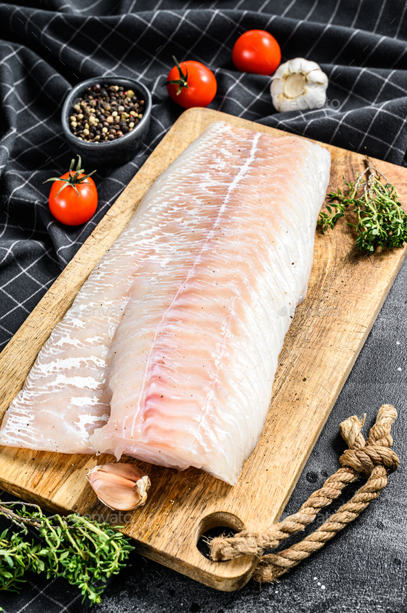 Fresh Raw Cod loin fillet with thyme. Black background. Top view Stock ...