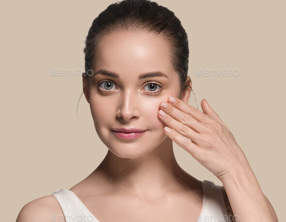 Clean skin woman face natural make up beautiful beauty model. Color background. Brown. - Stock Photo - Images