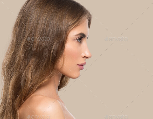 Beauty woman face profile portrait. Healthy beautiful skin female on color background brown - Stock Photo - Images