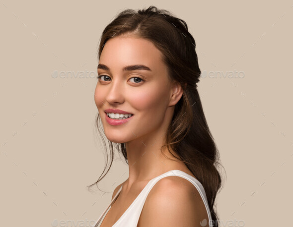 Beauty woman face healthy skin care female beautiful woman. Color brown background. - Stock Photo - Images