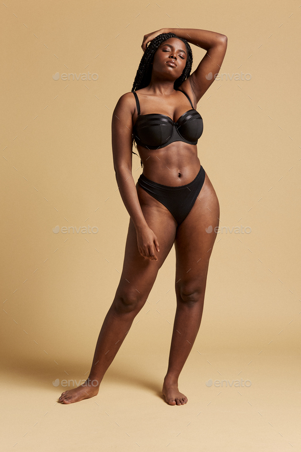 Plus size black model in underwear Stock Photo by ADDICTIVE_STOCK