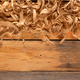 Wood shaving on table background. Wooden shaving at old plank board texture  Stock Photo by seregam