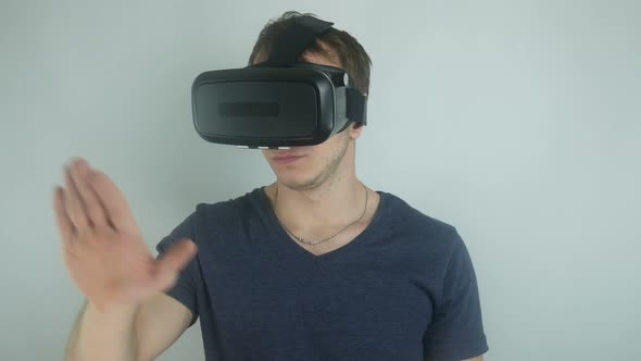Man Uses a Virtual Sensor in a Virtual Reality Helmet