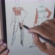 Top Down of Female Designer Drawing Fashion Sketch - VideoHive Item for Sale