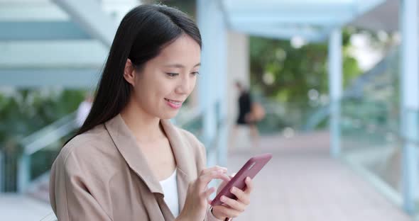 Woman use of mobile phone for online alt
