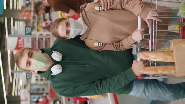 Young Couple In Hypermarket alt