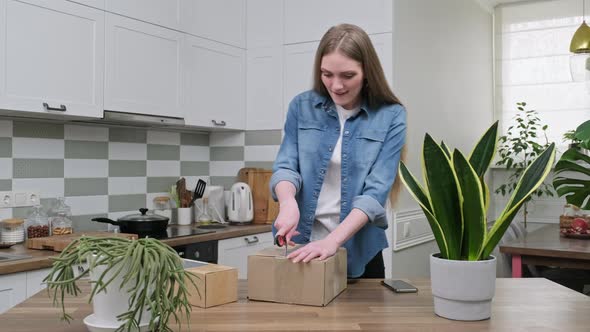 Young Happy Woman Unpacking Cardboard Boxes Unboxing Expected Postal Parcel alt
