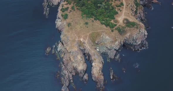 beautiful rocks with blue sea shot from high alt
