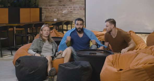Wide Shot of Multiethnic Men with Ukrainian Flag Rejoicing Victory of Favorite Team. Caucasian and alt