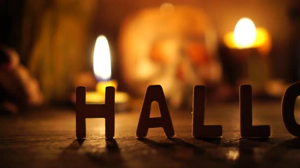 The concept of the Halloween festival with the orange pumpkin, candle light, and the bone skull alt