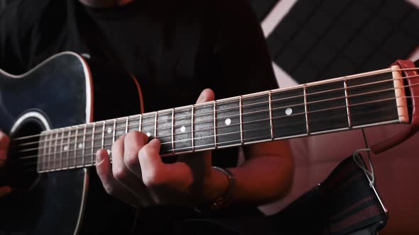 Young Man Playing Acoustic Guitar While Sitting Sofa Home Recording Studio alt